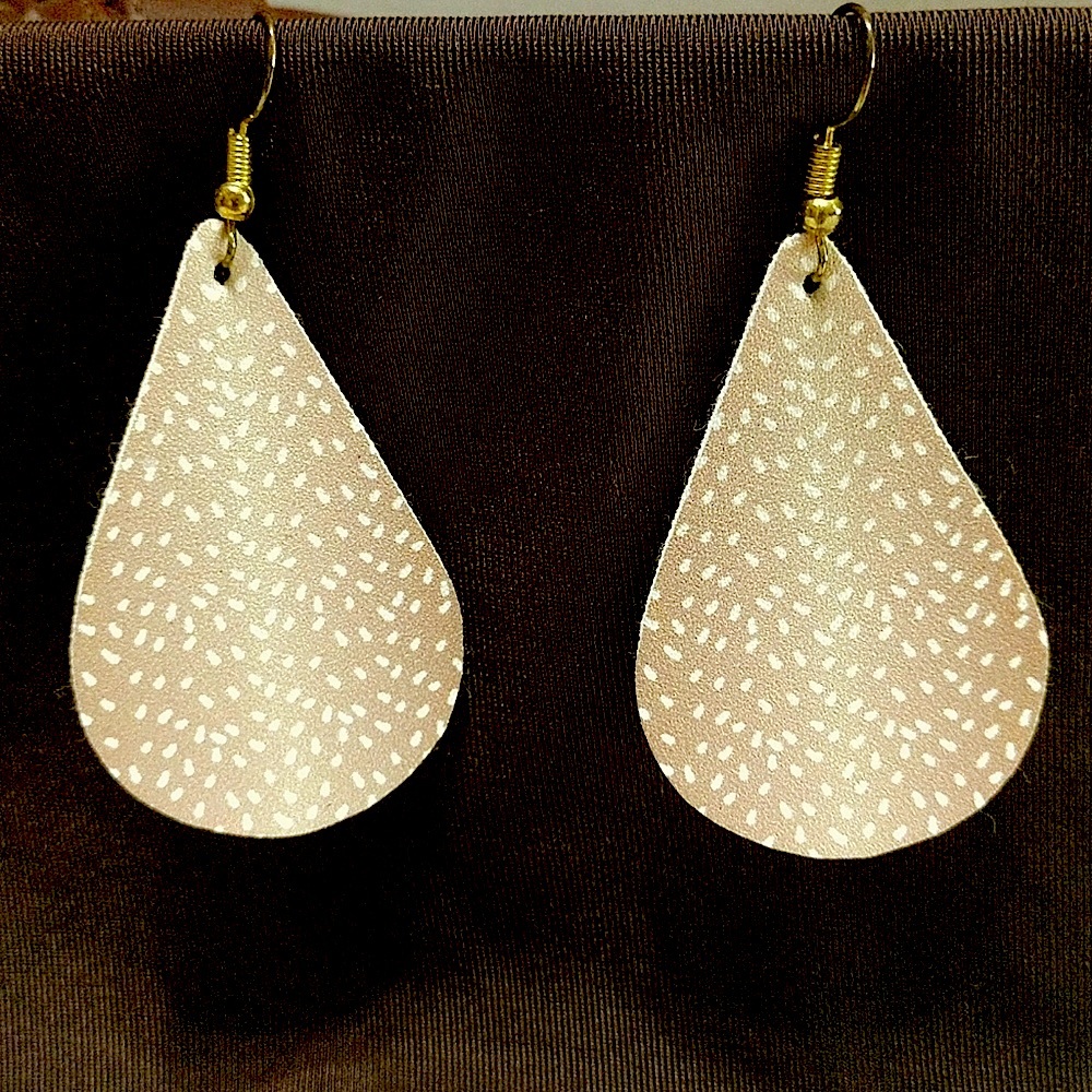 Super cute tan and white faux leather lightweight earrings.